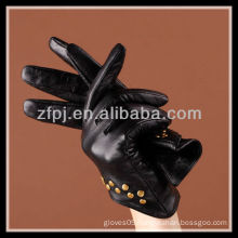 fashion designed women wearing gloves with nails leather